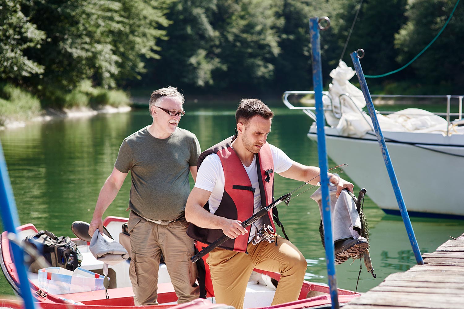 senior-man-with-son-on-the-boat-resize.jpg